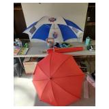 2 umbrellas, Red one is hand held, Old Style is either hand heald or has in the ground Extension, along with Hand weights and more
