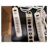 Three Six-Outlet Power Strips and One Extension Cord