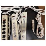 Three Six-Outlet Power Strips and One Extension Cord