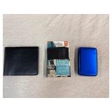 Three Unused Wallets - Leather, Aluminum and Lewis and Clark Data Block