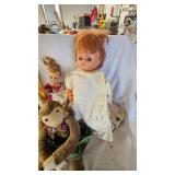 Assorted Dolls and Doll Stand