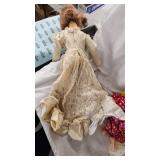 Assorted Dolls and Doll Stand