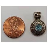 Sterling Silver Pendant with Blue Gemstone Centerpiece