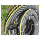 Large roll of 6in plastic drain pip...