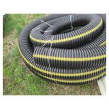Large roll of 6in plastic drain pip...