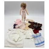 Collectible Vintage Porcelain Doll with Assorted Clothing by Marlene Gaige