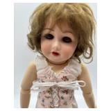 Collectible Vintage Porcelain Doll with Assorted Clothing by Marlene Gaige