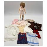 Collectible Vintage Porcelain Doll with Assorted Clothing by Marlene Gaige