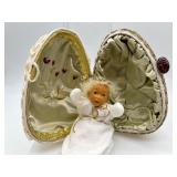 Handcrafted Decorative Egg with Cherubic Figures and Accessories