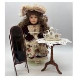 Vintage Porcelain Doll with Tea Set, Mirror, and Table