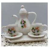 Vintage Porcelain Doll with Tea Set, Mirror, and Table