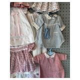 Collection of 17 Vintage Baby Doll Clothes, Various Styles and Fabrics