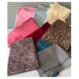 Collection of Assorted Fabric Pieces in Various Patterns and Colors
