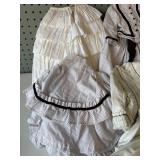 Collection of Vintage Doll Dresses with Lace and Ribbon Details