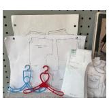 Assorted Doll Dress Patterns with Variety of Miniature Hangers