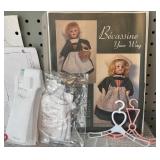 Assorted Doll Dress Patterns with Variety of Miniature Hangers
