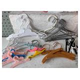 Assorted Doll Dress Patterns with Variety of Miniature Hangers