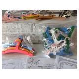 Assorted Doll Dress Patterns with Variety of Miniature Hangers