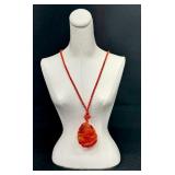 Vintage Heavily Carved Stone Pendant on Braided Cord