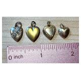 Four Vintage and Antique Heart Pendants including a 14K Gold Pendant and 10K Pendants