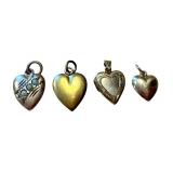 Four Vintage and Antique Heart Pendants including a 14K Gold Pendant and 10K Pendants