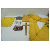Raingear, ponchos, wooden cross, vintage bag