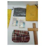 Raingear, ponchos, wooden cross, vintage bag