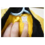 Raingear, ponchos, wooden cross, vintage bag