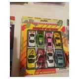 Collection of 6 Toy Sets including Mini Monster Trucks and Porcelain Tea Set