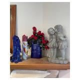 Assorted Decorative Items Including Figurines, Candle Holders, and Floral Arrangements