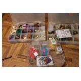 3 small organizers filled with tiny...