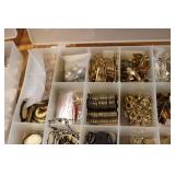 3 small organizers filled with tiny...