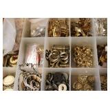 3 small organizers filled with tiny...