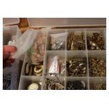 3 small organizers filled with tiny...