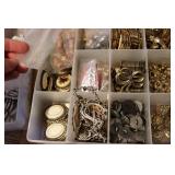 3 small organizers filled with tiny...