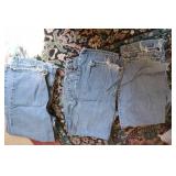 3 pairs of levi jeans sizes are pic...