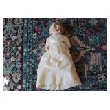 Antique doll in white dress...