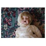Antique doll in white dress...