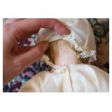 Antique doll in white dress...