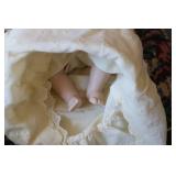 Antique doll in white dress...