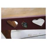 Rustic Wooden Bench with Heart Cutouts and Floral Details