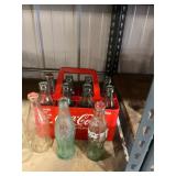 coke bottles and Carrier 12 bottles