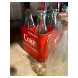 coke bottles and Carrier 12 bottles