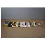 Assorted 45 RPM Vinyl Records and the Beatles VHS