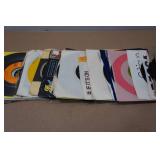 Assorted 45 RPM Vinyl Records and the Beatles VHS