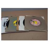 Assorted 45 RPM Vinyl Records and the Beatles VHS