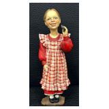 Adorable Norwegian Girl with a Cookie Figurine