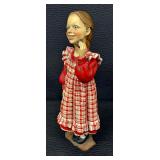Adorable Norwegian Girl with a Cookie Figurine