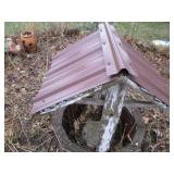 Decorative garden wishing well...