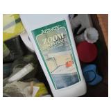 Box of household cleaning supplies ...